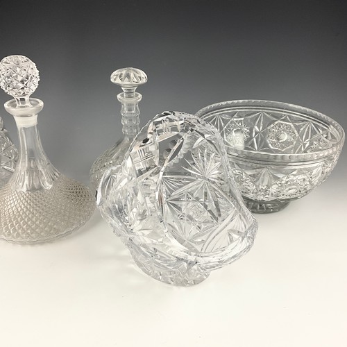 224 - A COLLECTION OF CUT GLASS INCLUDING DECANTERS, BOWL, SWING HANDLES BASKET, DRINKING GLASSES ETC