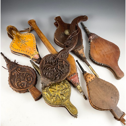 266 - A COLLECTION OF ANTIQUE BELLOWS, INCLUDING A CARVED OAK PAIR WITH SINUOUS BRANCH FORM HANDLES (8)