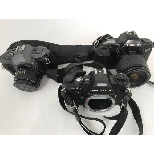 323 - MISC. CAMERAS AND CAMERA ACCESSORIES, LENSES ETC. INC. CANON AND PENTAX AND A SONY PSP