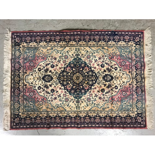 667 - RED & CREAM RUG. 135cm x 97cm