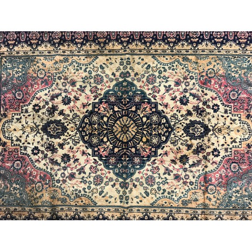 667 - RED & CREAM RUG. 135cm x 97cm