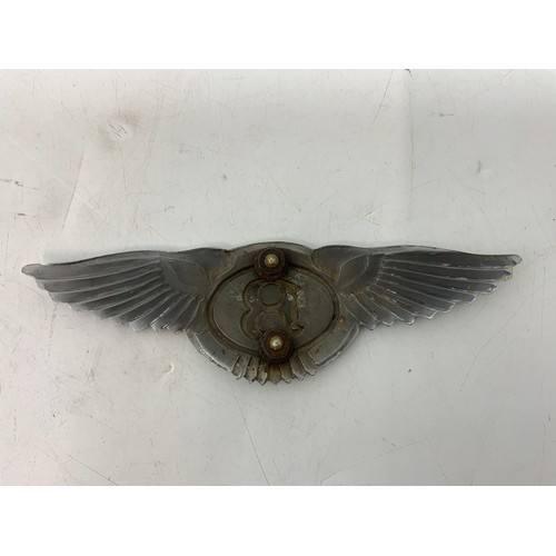 32 - BENTLEY CAR BADGE APPROX 16 CAM LONG, MOUNTS AT REAR, SOME CHIPPING TO THE ENAMEL AROUND THE B