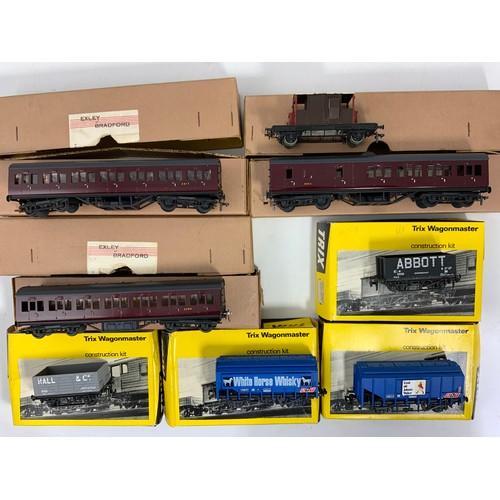 428 - 4 BOXED TRIX 00 SCALE WAGONS & 3 BOXED EXLEY 00 GAUGE COACHES