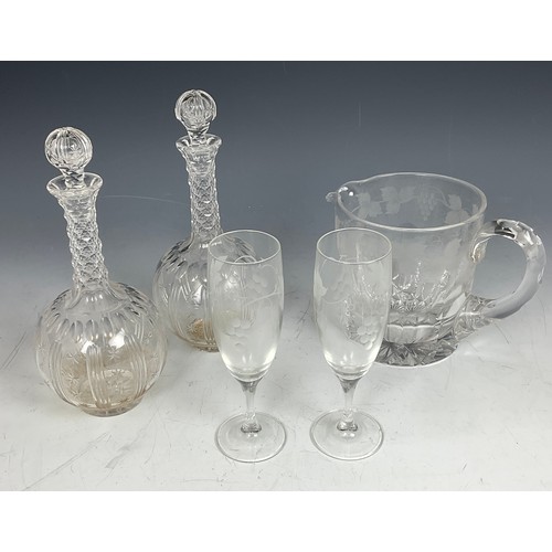 227 - PAIR OF DECANTERS AND A VINE ENGRAVED WATER JUG AND TWO FLUTES