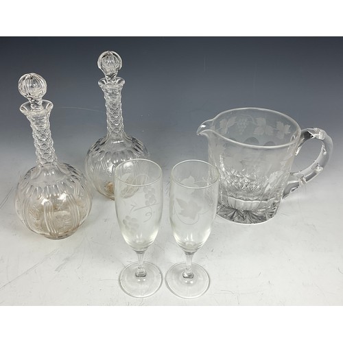 227 - PAIR OF DECANTERS AND A VINE ENGRAVED WATER JUG AND TWO FLUTES