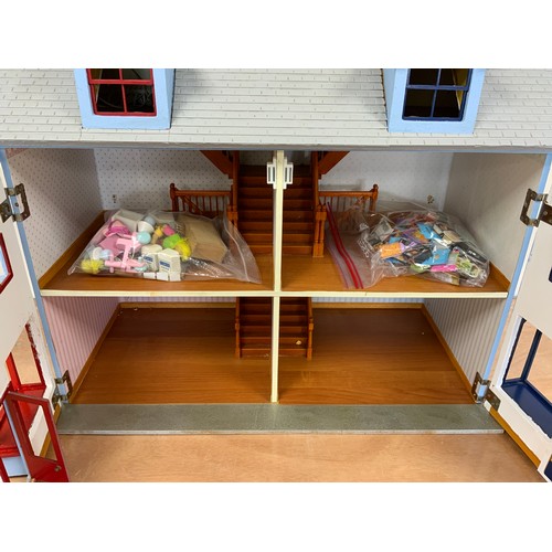 36 - A DOUBLE FRONTED DOLLS HOUSE WITH SHOP FRONTS, APPROX 82 CM WIDE, WITH A SELECTION OF DOLLS HOUSE FU... 