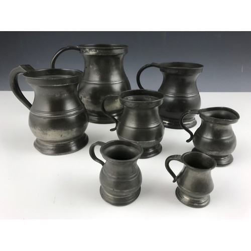 297 - 7 GRADUATED PEWTER TANKARDS