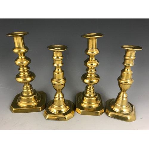 282 - 2 PAIRS OF BRASS CANDLESTICKS & A PAIR OF HEAVY BRASS PRIKET CANDLESTICKS