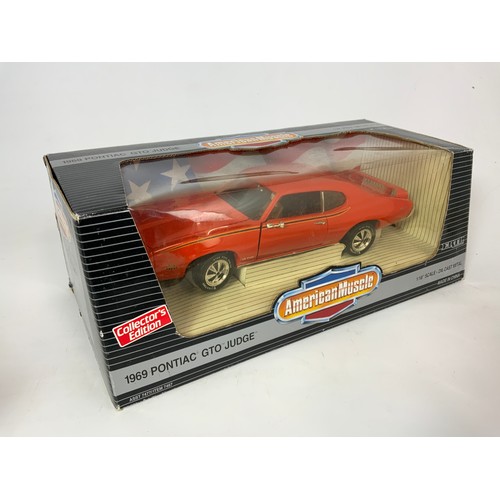 182 - 2 BOXED AMERICAN MUSCLE CARS, BY ERTL, 1:18 SCALE, 1969 PONTIAC GTO JUDGE, & A 1970 PLYMOUTH AAR ‘CU... 