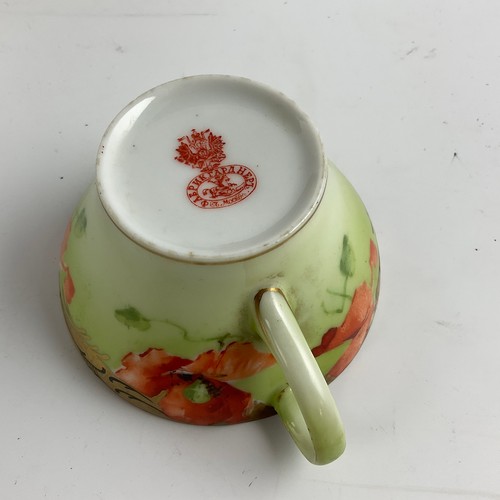 88 - A RUSSIAN GARDNER PORCELAIN  HANPAINTED TEA CUP AND SAUCER, DECORATED WITH POPPIES AND FLOWER BUDS O... 