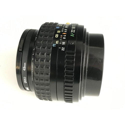 244 - ​PENTAX LENS.  F=50mm.  1:1/4.  C/W HOYA HMC UV(c)  49mm FILTER.  BACK CAP AND LENS CAP.  LENS CONDI... 