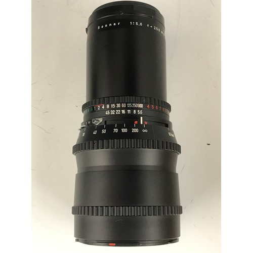 250 - HASSELBLAD LENSES INC. CARL ZEISS T* TELEPHOTO LENS, 250 mm 1:5.6, REMOVABLE HOOD, BLACK CAP AND LEN... 