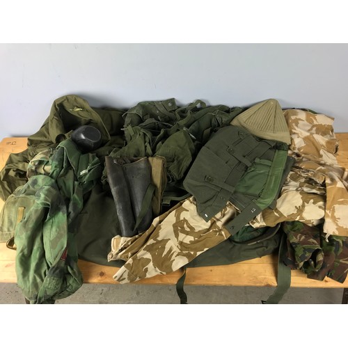 180 - VERY LARGE QTY. CANVAS AND OTHER MILITARY UNIFORM AND ACCESSORIES INC. BELTS, BUCKLES, KIT BAG, CANT... 