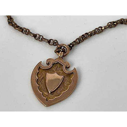 604 - SHIELD SHAPED 9CT GOLD FOB ON MUFF CHAIN