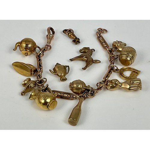 605 - 9CT GOLD CHARM BRACELET AND CHARMS, APPROX. 22.9g GROSS