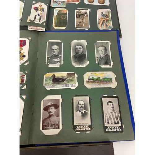 285 - A GOOD COLLECTION OF CIGARETTE CARDS IN ALBUMS INCLUDING SCARCE EXAMPLES