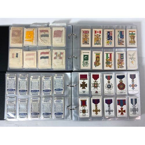 291 - 2 ALBUMS OF CIGARETTE CARDS IN SLIP CASES. ONE ALBUM WITH CARDS FROM A RANGE OF MANUFACTURERS, INC. ... 