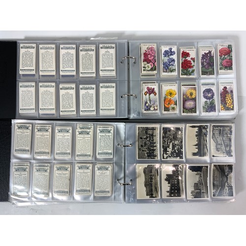 291 - 2 ALBUMS OF CIGARETTE CARDS IN SLIP CASES. ONE ALBUM WITH CARDS FROM A RANGE OF MANUFACTURERS, INC. ... 