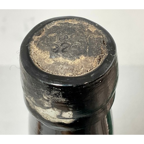 63 - AN UNIDENTIFIED BOTTLE, BELIEVED TO BE VINTAGE PORT WITH THE REMAINS OF A CAPSULE, POSSIBLY ‘VINTAGE... 