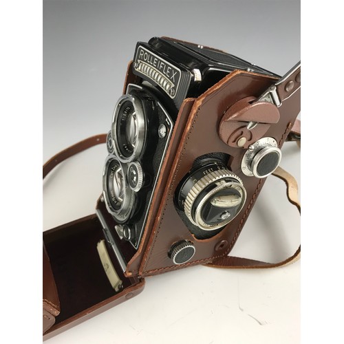 259 - ROLLEIFLEX, TWIN LENS CAMERA WITH MAKERS LEATHER CASE AND NECK/SHOULDER STRAP.  WITH LIGHT METER IN ... 