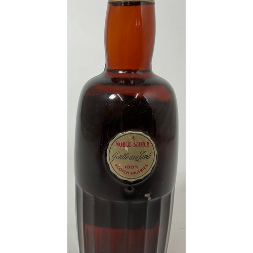 2 - OLD ANGUS LIQUEUR BLENDED SCOTCH WHISKY. DISTILLED BLENDED AND BOTTLED BY TRAIN & MCINTYRE LTD. SAYS... 