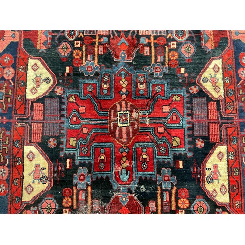 745 - IRANIAN RED GROUND CARPET 303CM X 162CM