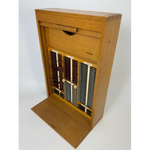 366 - OPTICIANS ‘ESSEL, LIGHT OAK TAMBOUR FRONT LENS CABINET AND CONTENTS 52cm TALL