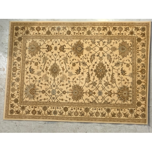 749 - BEIGE RUG 195CM X 140CM