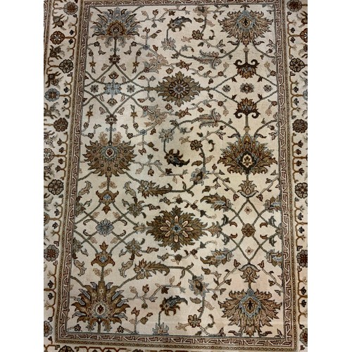 749 - BEIGE RUG 195CM X 140CM