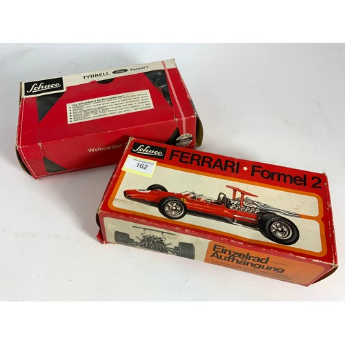 162 - 2 BOXED SCHUCO MODELS, FERRARI FORMEL2 1073, & 356 176 TYRRELL FORMULA 1 CAR