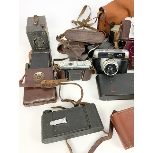 329 - QUANTITY OF VINTAGE CAMERAS INC KODAK, ZENIT , HALINA ETC