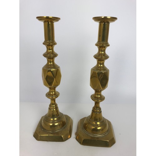 245 - PAIR OF LARGE BRASS CANDLESTICKS TOGETHER WITH A PAIR OF CHAMBERSTICKS