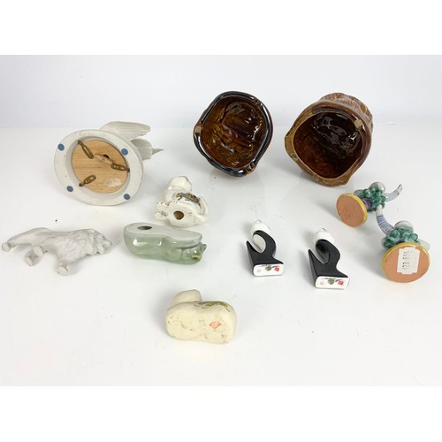 110 - 2 TREACLE GLAZED LION HEADS TOGETHER WITH OTHER CHINA AND PORCELAIN CAT FIGURES ETC.