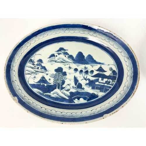 182 - ROUND AND OVAL BLUE AND WHITE DECORATED ORIENTAL PLATES TOGETHER WITH A GINGER JAR (NO LID)