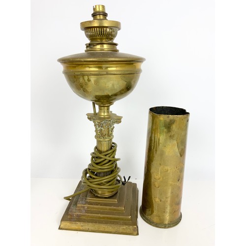 248 - BRASS CANDLESTICKS, CONVERTED CORINTHIAN COLUMN BRASS OIL LAMP AND A BRASS SHELL CASE