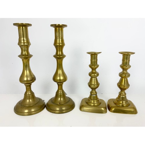 248 - BRASS CANDLESTICKS, CONVERTED CORINTHIAN COLUMN BRASS OIL LAMP AND A BRASS SHELL CASE