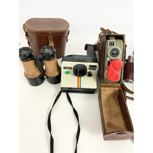 331 - MISC. CAMERAS AND BINOCULARS INCLUDING KODAK AND PRACTICA 35MM CAMERAS, EUMIG CINE CAMERA AND A POLA... 