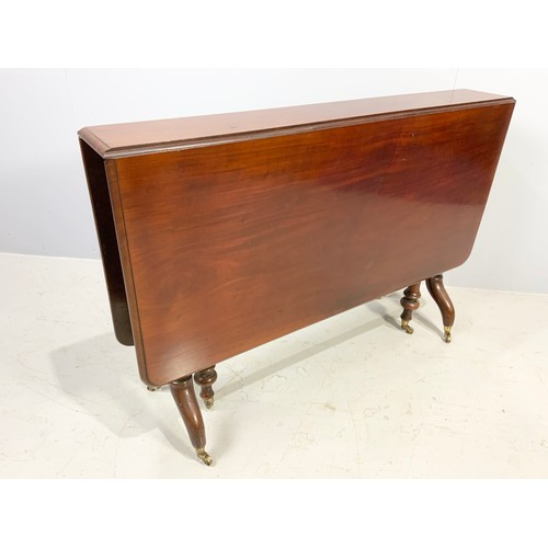 485 - MAHOGANY SUTHERLAND TABLE WITH BRASS CASTORS 114cm x106cm