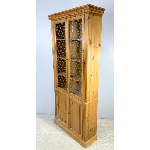 534 - MODERN PINE CABINET WITH LEADED GLASS ABOVE DOUBLE DOOR CUPBOARD 200cm TALL