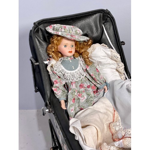 325 - DOLLS PRAM TOGETHER PORCELAIN HEAD DOLL, A ROCKING COT AND 2 OTHER PORCELAIN HEAD DOLLS