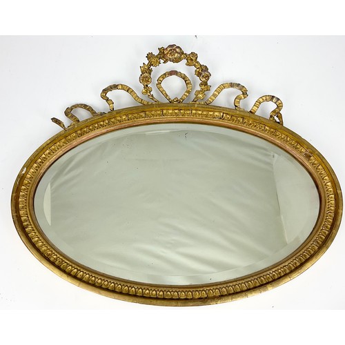 63 - OVAL MIRROR WITH ORNATE GILT FRAME, APPROX. 56 cm