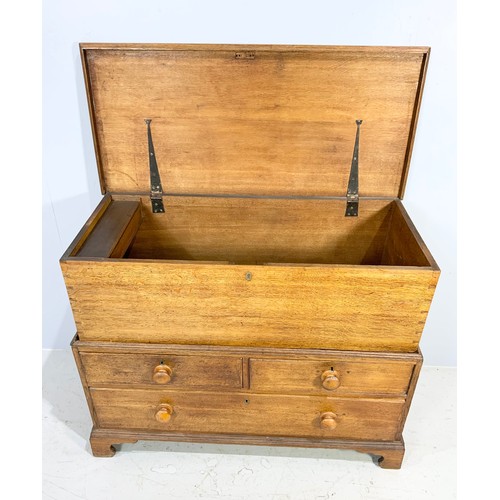 554 - UNUSUAL LIGHT OAK BLANKET CHEST WITH HINGED LID ON 2 OVER 1 DRAWER BASE WITH TURNED HANDLES