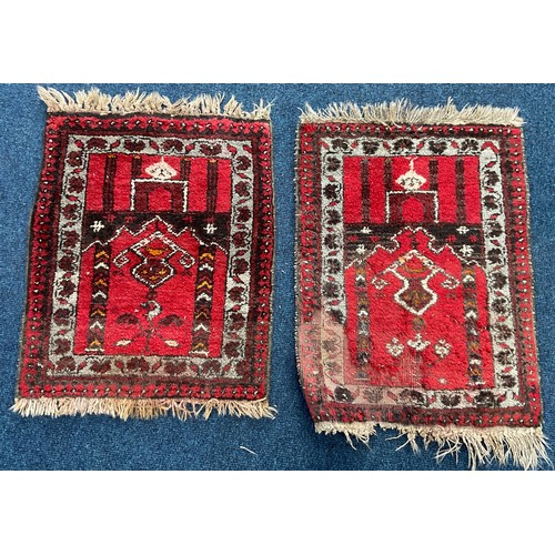 680 - A PAIR OF SMALL RED GROUND RUGS APPROX 70X53 CM