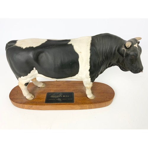 106 - BESWICK CONNOISSEUR MODELS OF A FRIESIAN BULL AND A FRIESIAN COW ON PLINTHS