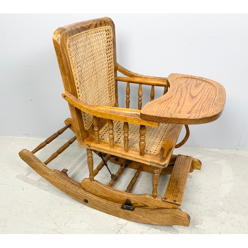 673 - CHILD’S METAMORPHIC OAK HIGH CHAIR/ ROCKER WITH CANED SEAT AND BACK