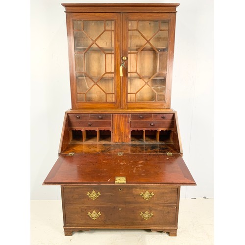 612 - MAHOGANY BUREAU BOOKCASE WITH FALL FRONT CONCEALING A FITTED INTERIOR AND ASTRAGAL GLAZED TOP