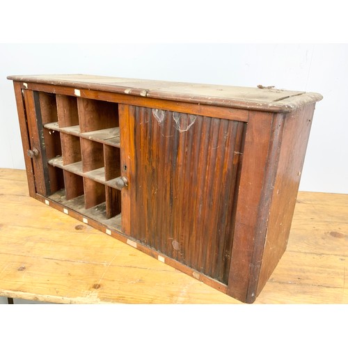 553 - CABINET WITH PIGEON HOLES AND TAMBOUR DOOR 90cm LONG