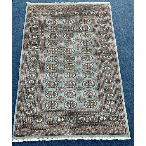 689 - BLUE GROUND RUG, APPROX. 188 x 125 cm, LABELLED LUXURY MORI BOKHARA