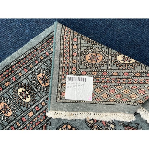 689 - BLUE GROUND RUG, APPROX. 188 x 125 cm, LABELLED LUXURY MORI BOKHARA