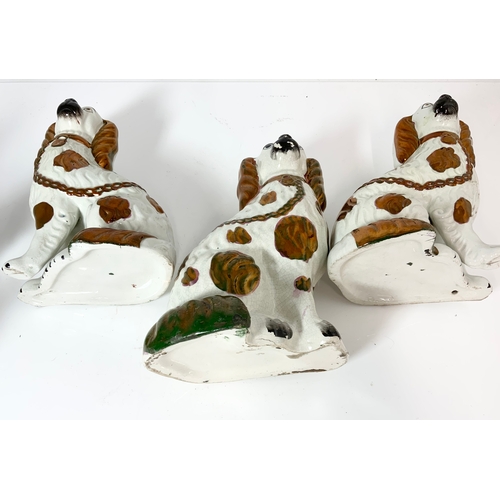 148 - 3 STAFFORDSHIRE DOGS WITH COPPER LUSTRE DECORATION, TALLEST 26cm